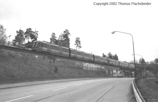 Rågsved, view from road with southbound train