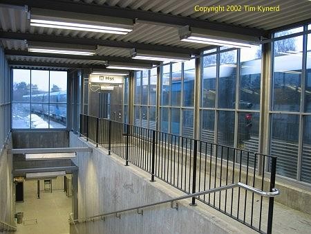 Stureby, top of stairs with northbound train arriving
